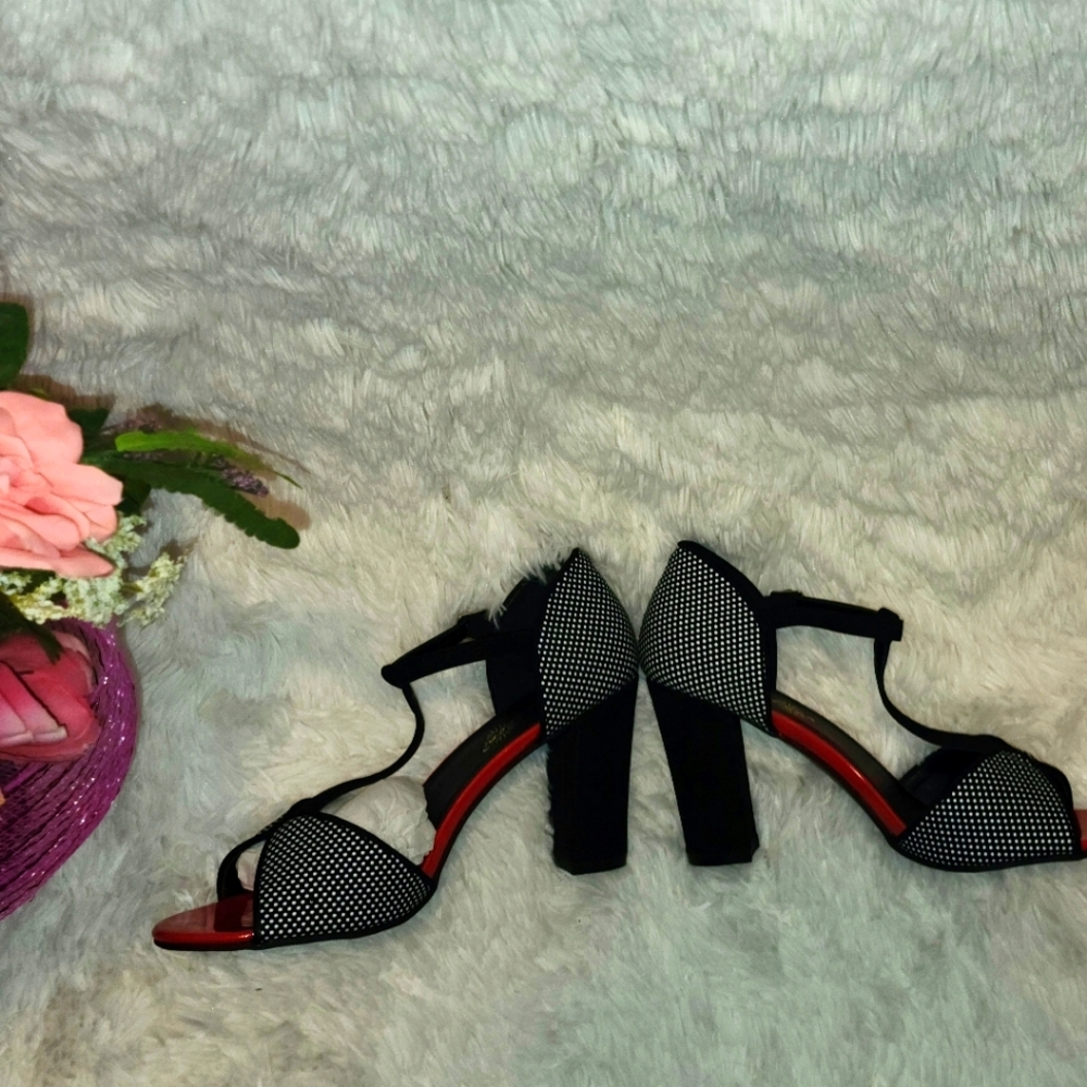 **Woman Red , Black, and White High Heels**